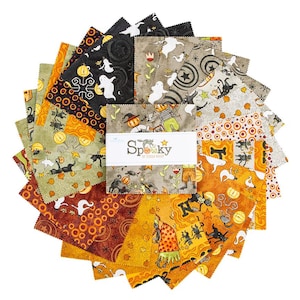 May include: A stack of square fabric swatches arranged in a circular fan pattern. The fabric features various Halloween-themed prints in orange, black, gray, and white, including ghosts, pumpkins, and cats. A white paper band reads Spooky by Teresa Kogut.