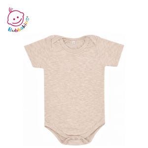 May include: A short-sleeved baby bodysuit in a solid light beige heathered fabric with a round neckline and three snap closures at the bottom. The Bubbakins logo is visible in the top left corner with a stylized baby face icon.