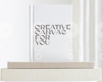 May include: White book with the text "CREATIVE CANVAS FOR YOU" printed in grey on the front cover.