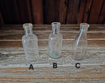Vintage clear small glass bottles