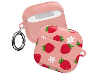 May include: Pink AirPods case with a strawberry pattern. The case is open, revealing the inside, and has a silver carabiner clip attached. The design features red strawberries and white flowers on a pink background.