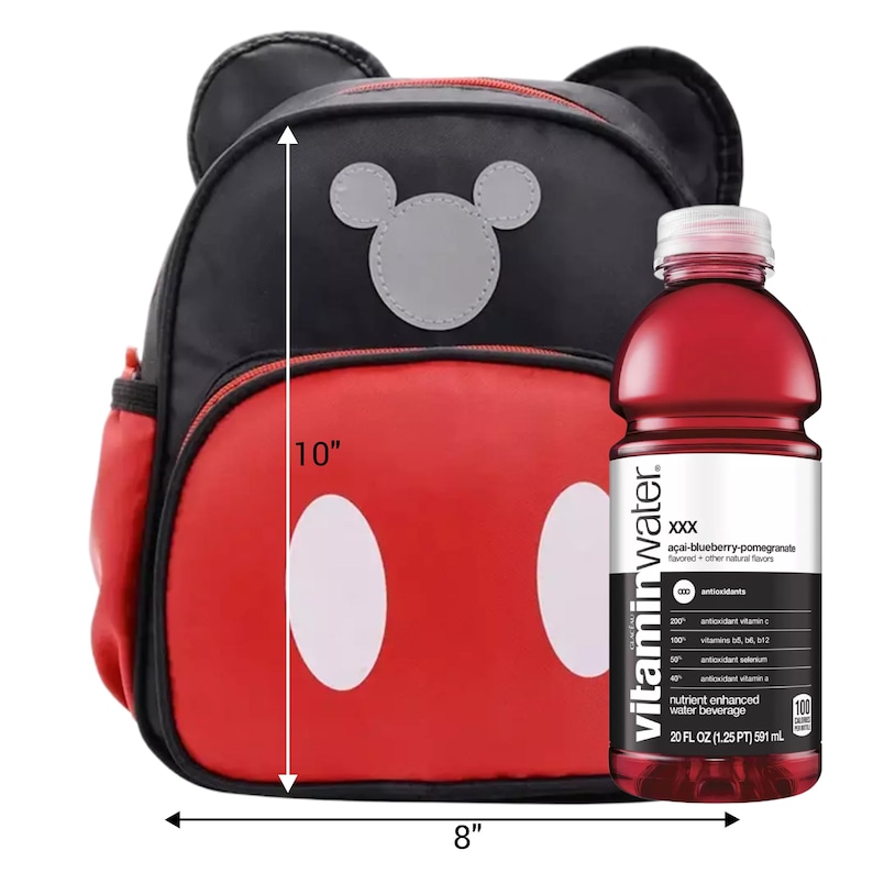 May include: A black and red backpack with mouse ears, a grey mouse head silhouette, and two white ovals, measuring 10 inches high and 8 inches wide, next to a 20 fluid ounce bottle of acai-blueberry-pomegranate flavored vitaminwater.