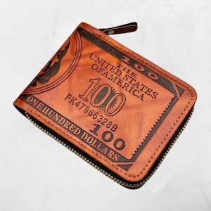 Cartera de cuero marrón con billete de 100 dólares estadounidenses - Cierre de cremallera