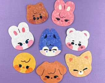 May include: Set of eight colourful animal stickers with a variety of expressions. The stickers are made of a textured material and feature a variety of animal designs, including a bunny, a fox, a cat, a dog, and a bear.