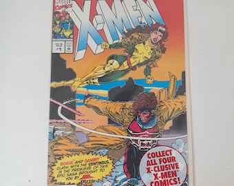 May include: Marvel Comics X-Men #1 comic book. The cover features Rogue and Gambit in action, with the X-Men logo in large letters. The comic is in a protective sleeve. The cover text includes "Marvel Collector's Edition" and "Collect All Four X-Clusive X-Men Comics!"