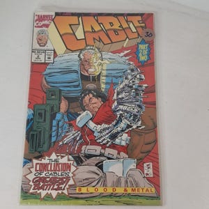 May include: A comic book titled "Cable" with a vibrant cover featuring a muscular character with cybernetic enhancements. The cover text includes "The Conclusion of Cable's Greatest Battle!" and "Blood & Metal."