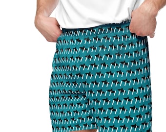 May include: Teal blue boxer shorts with a repeating pattern of black bats and white lines.