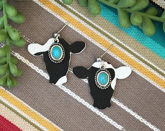 Brincos de cabeça de vaca