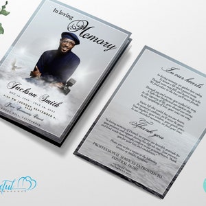 May include: A blue and white funeral announcement card with a photo of a man in a black suit and a white shirt. The card includes the text "In Loving Memory" and "Jackson Smith" with dates of birth and death. The card also includes the text "Grace Community Church" and "Bouge Hill, California".