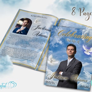 May include: A blue and white memorial booklet with a gold border and the text "Celebrating the life of Jackson Adams" on the front cover. The booklet features a photo of Jackson Adams against a cloudy sky with two white doves flying above him. The back cover features a photo of Jackson Adams in a suit and tie, with the text "Remembering Jackson Adams" and a white dove flying above him.
