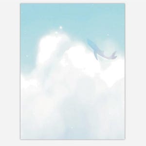May include: A rectangular print featuring a light blue sky filled with soft white clouds. A silhouette of a whale is visible in the upper right section, appearing to swim through the clouds. Small white specks are scattered throughout the sky.