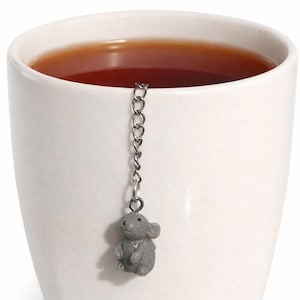 May include: A rustic wooden sign with the text "Welcome to our home" in white lettering. The sign features a distressed finish and a simple, inviting design, perfect for front door decor.