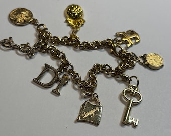 Diamonds International Charm Bracelet in Goldtone