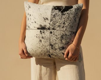 Leren kussensloop van rundleer: zwart-wit patchwork, achterkant echt leer