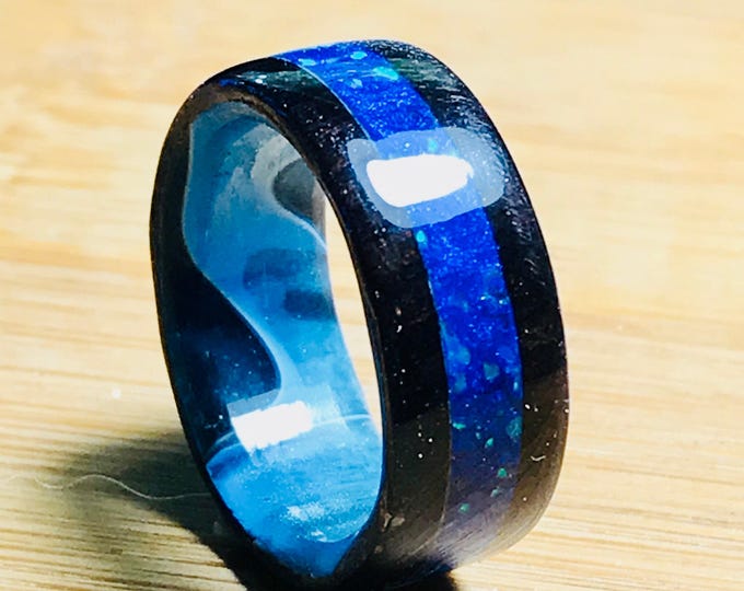 African Blackwood Ring, Crushed Blue Bello Opal Inlay, and Blue Swirl Epoxy Core.