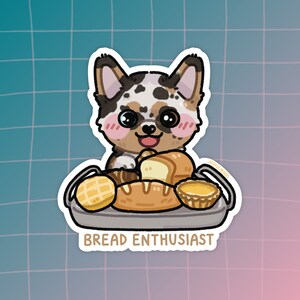 May include: A cartoon sticker of a dog with brown, black, and white fur holding a basket of bread. The dog is smiling and has a pink nose. The basket contains a variety of bread, including a loaf of bread, a croissant, and a pastry. The sticker has the text "Bread Enthusiast" at the bottom.