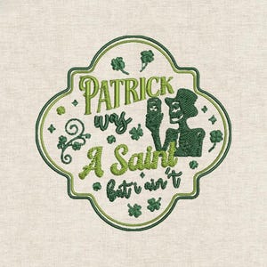 May include: Embroidered patch with a green and white design. The patch features the text "Patrick was a Saint but ain't" in a decorative font, along with shamrocks and a skeleton figure. The patch is on a beige fabric background.