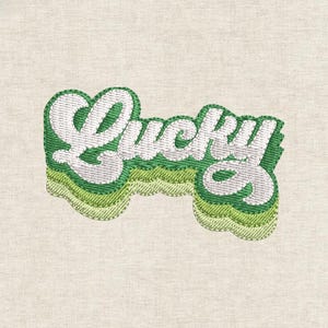 May include: Embroidered patch with the word "Lucky" in white, outlined in green, and layered over a wavy green background. The patch is on a light beige fabric.