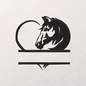 May include: Black embroidered horse head within a heart-shaped frame. The design includes a horizontal bar for text and a decorative element below. The image is on a white background.