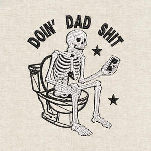May include: Embroidered design of a skeleton on a toilet, using a phone. The text reads "DOIN' DAD SHIT" in black. Two black stars are included. The design is on a beige background.