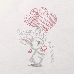 May include: Embroidered design featuring a cute bunny holding a heart and two heart-shaped balloons. The text "Somewhere out there" is written in cursive. The bunny is white with gray accents and red hearts.