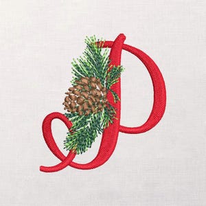 May include: Embroidered red letter "P" with a festive design. The letter is adorned with a pine cone and evergreen branches, creating a holiday or seasonal theme. The embroidery is detailed and stands out against the white background.