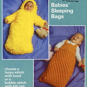 May include: Two knitted baby sleeping bags. One is yellow with a loopy stitch and a hood. The other is orange with a bobble stitch and a bib-top. The text "Babies' Sleeping Bags" is at the top of the image.