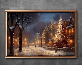 Könnte beinhalten: Gerahmtes Gemälde einer verschneiten Winterszene in der Dämmerung. Die Kunst zeigt eine Straße mit Gebäuden und Straßenlaternen. Ein geschmückter Weihnachtsbaum steht vor einem Gebäude und verleiht der Winterlandschaft eine festliche Note.