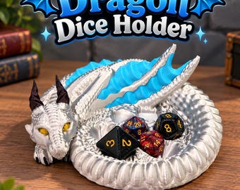 May include: A silver dragon-shaped dice holder with bright blue dorsal fins, black horns, and yellow eyes. The dragon is coiled in a circular shape, creating a central tray containing four multi-sided gaming dice with gold numbers.