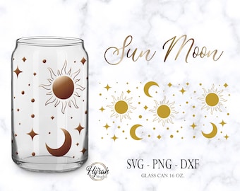 May include: A glass can with a gold sun and moon design. The can is 16 ounces and has a clear glass body. The design features a sun with rays, a crescent moon, and stars. The text "Sun Moon" is written in gold lettering above the can.