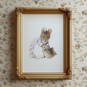 May include: A framed print featuring a charming illustration of a mouse dressed in a purple and white floral outfit, holding a broom and dustpan. The print is set within a gold ornate frame, adding a touch of vintage elegance. The background is a floral wallpaper.