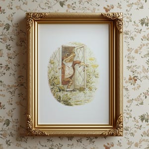 May include: A framed print featuring a frog character in a red coat and vest, emerging from a door. The print is set in a gold ornate frame, against a floral wallpaper background.