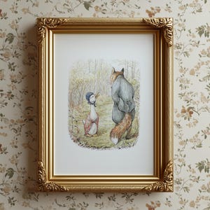 May include: A framed print featuring a whimsical illustration of a goose and a fox in a forest setting. The artwork is enclosed in a gold ornate frame. The goose is wearing a bonnet and vest, while the fox is dressed in a coat.