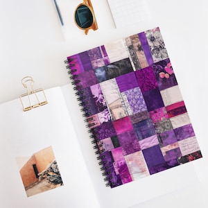 May include: Purple and pink patterned spiral notebook with a patchwork design. The notebook has a white background with a variety of purple and pink squares and rectangles.