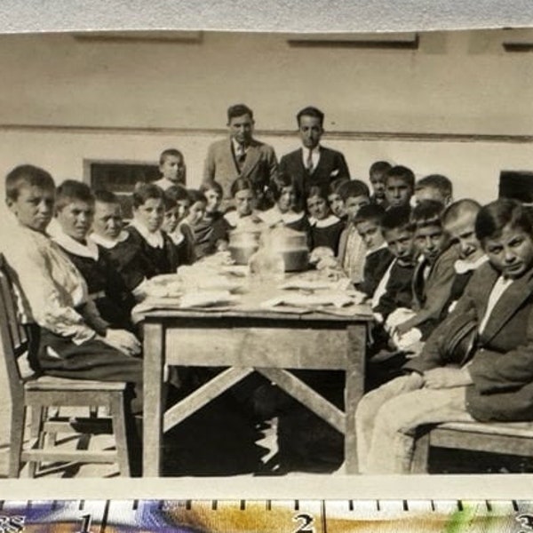 Lunch Time on Wooden Tables and Wooden Chairs in the School Garden. Historical Photograph of Teachers and Students Türkiye, circa 1930s