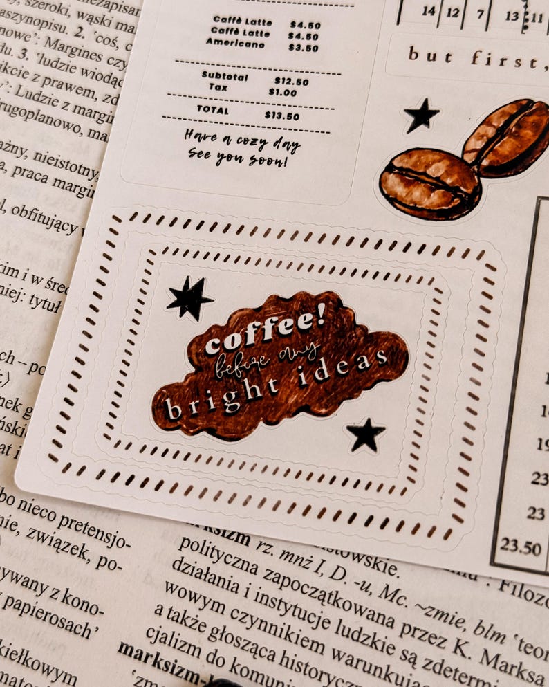 May include: A sticker sheet with coffee-themed designs. Includes coffee beans, stars, and a cloud-shaped sticker with the text "coffee! before my bright ideas". The sheet also features a receipt and the phrase "Have a cozy day, See you soon!"