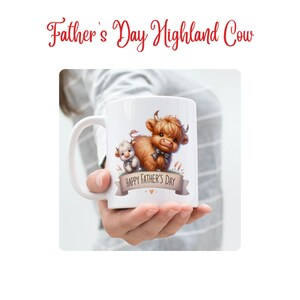 May include: White ceramic mug with a brown and white highland cow and a smaller calf. The mug has a brown ribbon with the text "Happy Father's Day" on it.