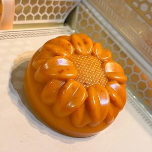 Sunflower soap with turmeric, rice, and geranium essential oil.