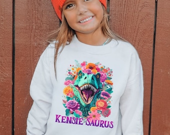 Dinosaur Girl Personalized Sweatshirt Custom Name, Floral Girl Dinosaur Shirt, T-Rex Birthday Outfit Kid Gift, Pink Dino Crewneck Sweatshirt