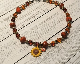 Designer Hundehalskette Royal Orange Bernstein Perlen mit Sonnenblumen Charms und Evil Eye Schutz Charm