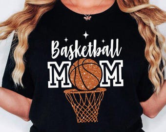 May include: Black t-shirt with the text "Basketball Mom" in white with a glittery orange basketball and hoop.