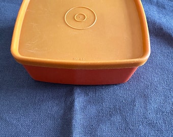 Tupperware orange storage container
