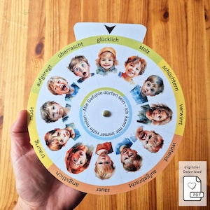 May include: A circular educational tool featuring watercolor illustrations of children expressing various emotions. The wheel includes labels such as "happy," "sad," and "angry." The text "digital download" and a PDF icon are visible.