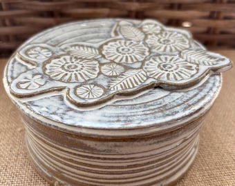 Hand thrown ceramic wild flower trinket dish with lid.