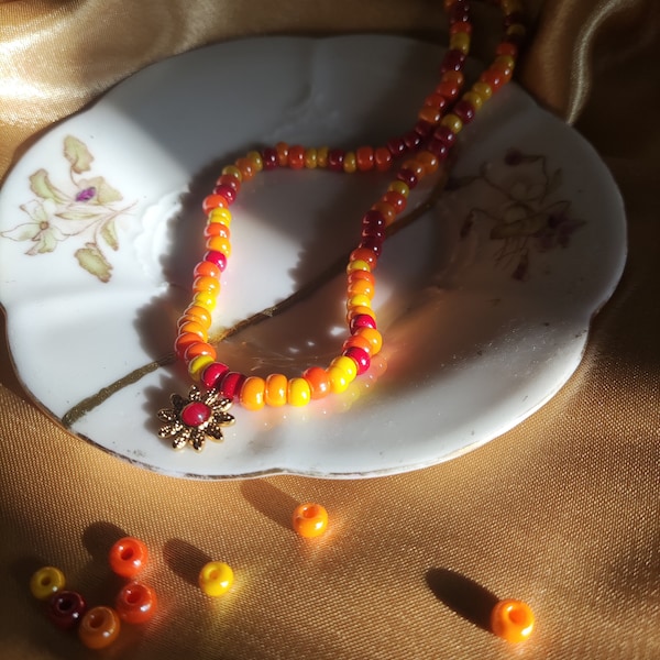 Collier de perles avec pendentif fleur