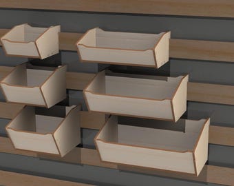 May include: Five wooden wall-mounted storage bins with a light wood finish. The bins are stacked in a staggered pattern, with the largest bin at the bottom and the smallest bin at the top.
