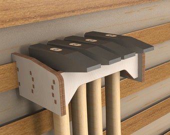 May include: A wooden wall-mounted storage rack for holding four hammers. The rack is made of light-colored wood and has a gray top with a cutout for the hammer heads. The hammers have wooden handles and black metal heads.