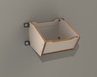 May include: A light wood wall shelf with a rectangular shape and rounded edges. The shelf is mounted to the wall with two black metal brackets and screws.