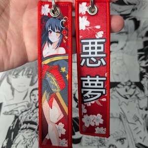 Llavero Jet Tag bordado tejido con manga de anime