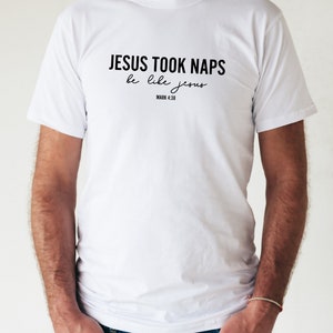 May include: White t-shirt with black text that reads "JESUS TOOK NAPS be like jesus MARK 4:38"